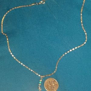 Necklace. Silver color and turquoise like bead.